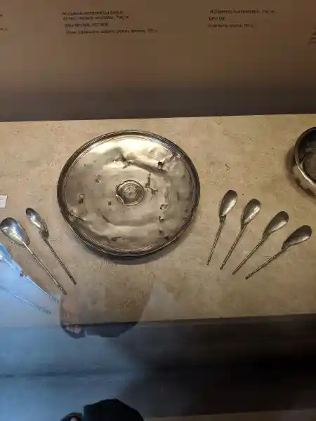 Byzantine silver tableware including a paten and spoons, 7th century